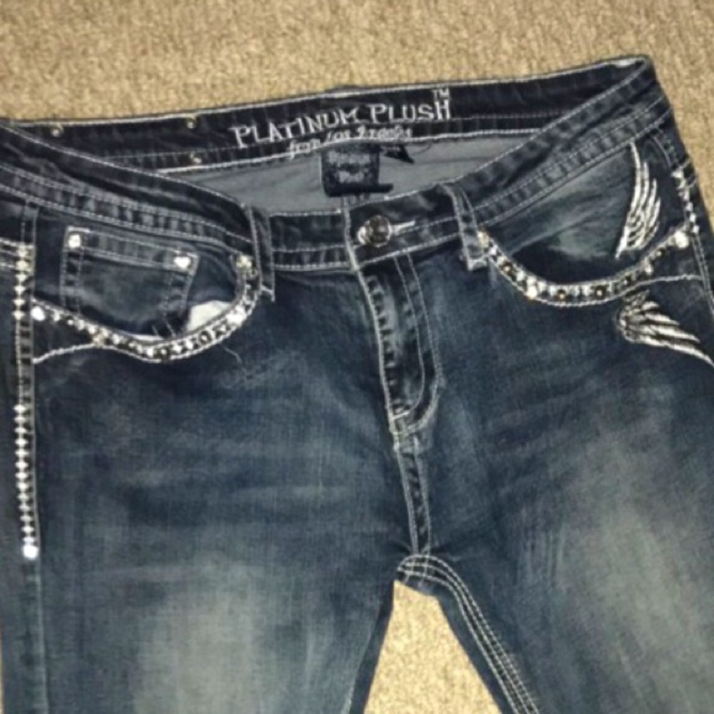 Platinum plush flared jeans with studded scull, size 9 barley used